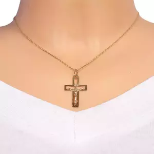 Arany medál - kivágott kereszt Krisztussal és fényes sugarakkal kép