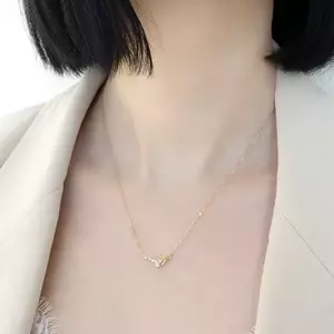 585 arany nyaklánc - átlátszó cirkóniás ív fényes, kötött masnival kép