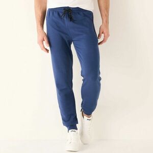 Sportos nadrág szűkülő végekkel és kontrasztos részletekkel kép